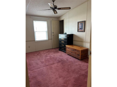 Double wide mobile home with 2 bedrooms, 2 Baths and 1040 sq ft on Orange Blossom Hills Golf and Country Club in Florida - for sale on GolfHomes.com, golf home, golf lot