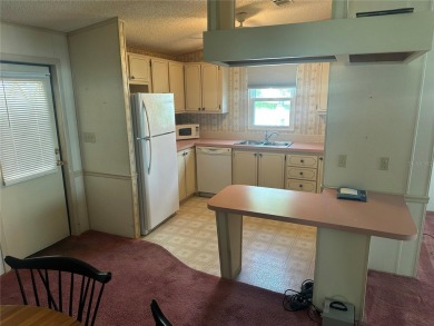 Double wide mobile home with 2 bedrooms, 2 Baths and 1040 sq ft on Orange Blossom Hills Golf and Country Club in Florida - for sale on GolfHomes.com, golf home, golf lot