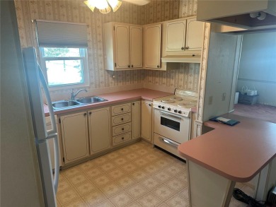 Double wide mobile home with 2 bedrooms, 2 Baths and 1040 sq ft on Orange Blossom Hills Golf and Country Club in Florida - for sale on GolfHomes.com, golf home, golf lot