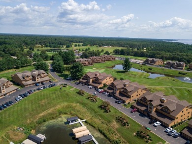 Stunning Furnished Condo on Castle Rock Lake! Discover luxury on Northern Bay Golf Resort and Marina in Wisconsin - for sale on GolfHomes.com, golf home, golf lot