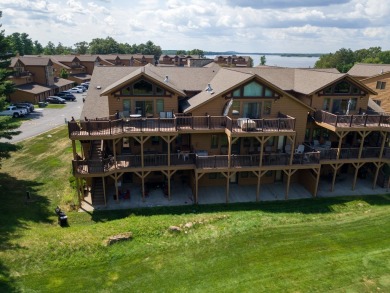 Stunning Furnished Condo on Castle Rock Lake! Discover luxury on Northern Bay Golf Resort and Marina in Wisconsin - for sale on GolfHomes.com, golf home, golf lot