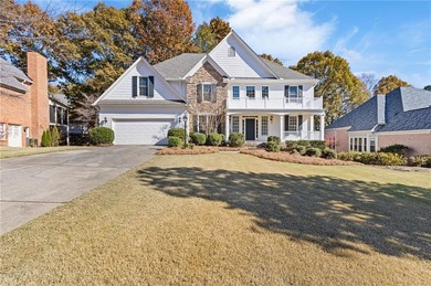 Beautiful traditional-style home with a rocking chair front on Canongate At Olde Atlanta Golf Club in Georgia - for sale on GolfHomes.com, golf home, golf lot