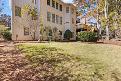 Beautiful traditional-style home with a rocking chair front on Canongate At Olde Atlanta Golf Club in Georgia - for sale on GolfHomes.com, golf home, golf lot