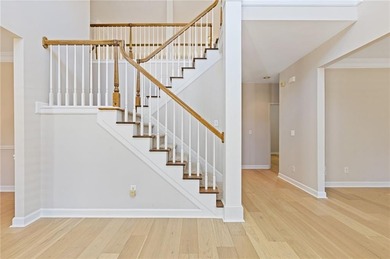 Beautiful traditional-style home with a rocking chair front on Canongate At Olde Atlanta Golf Club in Georgia - for sale on GolfHomes.com, golf home, golf lot