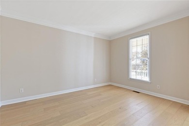 Beautiful traditional-style home with a rocking chair front on Canongate At Olde Atlanta Golf Club in Georgia - for sale on GolfHomes.com, golf home, golf lot