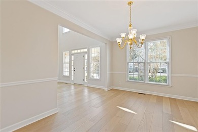 Beautiful traditional-style home with a rocking chair front on Canongate At Olde Atlanta Golf Club in Georgia - for sale on GolfHomes.com, golf home, golf lot