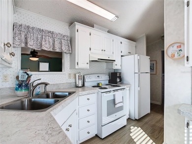 Step into this well-cared-for home where pride of ownership is on Lily Lake Golf and RV Resort in Florida - for sale on GolfHomes.com, golf home, golf lot