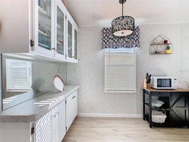 Step into this well-cared-for home where pride of ownership is on Lily Lake Golf and RV Resort in Florida - for sale on GolfHomes.com, golf home, golf lot