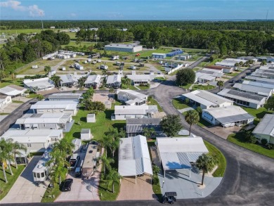 Step into this well-cared-for home where pride of ownership is on Lily Lake Golf and RV Resort in Florida - for sale on GolfHomes.com, golf home, golf lot