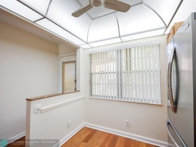 BRAND NEW VINYL FLOORING, NEVER-USED TOP-LINE SS APPLIANCES W/ on Wynmoor Golf Course in Florida - for sale on GolfHomes.com, golf home, golf lot