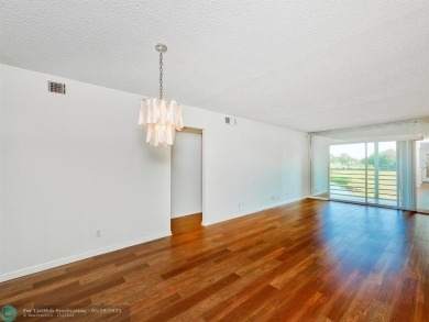 BRAND NEW VINYL FLOORING, NEVER-USED TOP-LINE SS APPLIANCES W/ on Wynmoor Golf Course in Florida - for sale on GolfHomes.com, golf home, golf lot