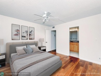 BRAND NEW VINYL FLOORING, NEVER-USED TOP-LINE SS APPLIANCES W/ on Wynmoor Golf Course in Florida - for sale on GolfHomes.com, golf home, golf lot