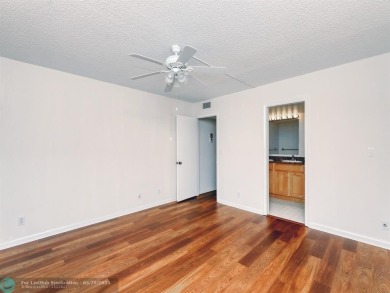 BRAND NEW VINYL FLOORING, NEVER-USED TOP-LINE SS APPLIANCES W/ on Wynmoor Golf Course in Florida - for sale on GolfHomes.com, golf home, golf lot