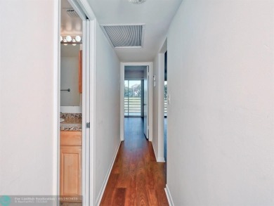 BRAND NEW VINYL FLOORING, NEVER-USED TOP-LINE SS APPLIANCES W/ on Wynmoor Golf Course in Florida - for sale on GolfHomes.com, golf home, golf lot