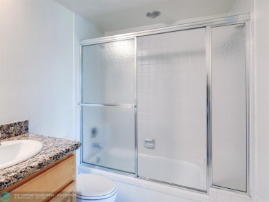 BRAND NEW VINYL FLOORING, NEVER-USED TOP-LINE SS APPLIANCES W/ on Wynmoor Golf Course in Florida - for sale on GolfHomes.com, golf home, golf lot