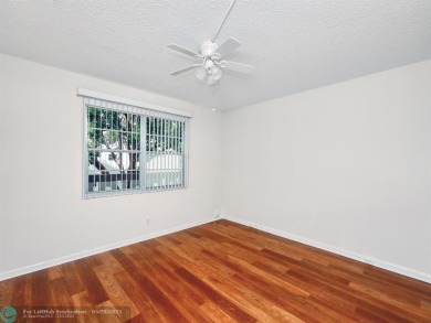 BRAND NEW VINYL FLOORING, NEVER-USED TOP-LINE SS APPLIANCES W/ on Wynmoor Golf Course in Florida - for sale on GolfHomes.com, golf home, golf lot