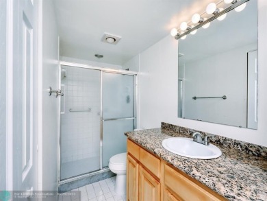 BRAND NEW VINYL FLOORING, NEVER-USED TOP-LINE SS APPLIANCES W/ on Wynmoor Golf Course in Florida - for sale on GolfHomes.com, golf home, golf lot