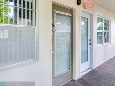 BRAND NEW VINYL FLOORING, NEVER-USED TOP-LINE SS APPLIANCES W/ on Wynmoor Golf Course in Florida - for sale on GolfHomes.com, golf home, golf lot