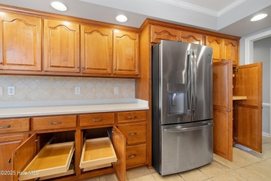Welcome to easy coastal living in this beautifully maintained on Sea Trail Golf Resort in North Carolina - for sale on GolfHomes.com, golf home, golf lot