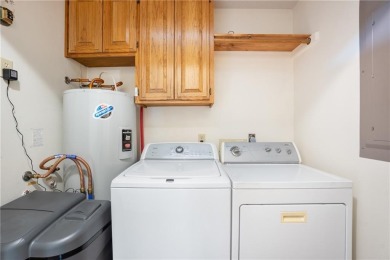 This beautifully updated home is on the 3rd green of a pristine on Holiday Island Golf Course in Arkansas - for sale on GolfHomes.com, golf home, golf lot