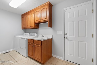 Welcome to easy coastal living in this beautifully maintained on Sea Trail Golf Resort in North Carolina - for sale on GolfHomes.com, golf home, golf lot