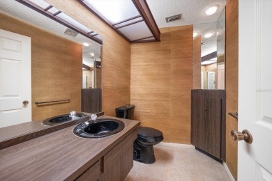 Welcome to this large ranch style, 4-bedroom, 2.5-bathroom home on Feather Sound Country Club in Florida - for sale on GolfHomes.com, golf home, golf lot