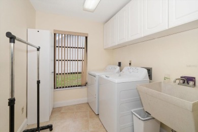 Welcome to this large ranch style, 4-bedroom, 2.5-bathroom home on Feather Sound Country Club in Florida - for sale on GolfHomes.com, golf home, golf lot
