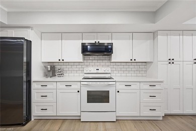 Updated golf course pool home with solar in gated Spanish Wells on Spanish Wells Golf and Country Club in Florida - for sale on GolfHomes.com, golf home, golf lot