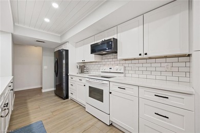 Updated golf course pool home with solar in gated Spanish Wells on Spanish Wells Golf and Country Club in Florida - for sale on GolfHomes.com, golf home, golf lot