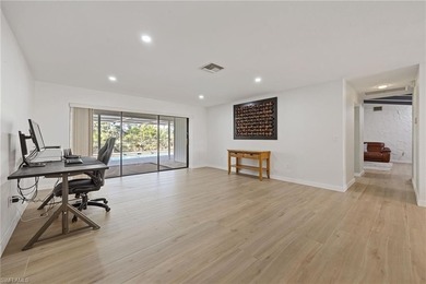 Updated golf course pool home with solar in gated Spanish Wells on Spanish Wells Golf and Country Club in Florida - for sale on GolfHomes.com, golf home, golf lot