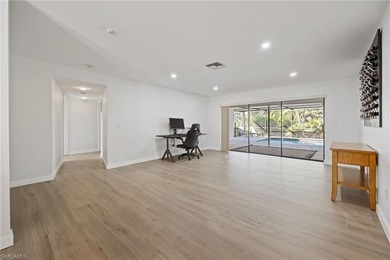 Updated golf course pool home with solar in gated Spanish Wells on Spanish Wells Golf and Country Club in Florida - for sale on GolfHomes.com, golf home, golf lot