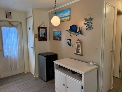 This lovely, manufactured home is on leased land in Lake on Pine Lakes Country Club in Florida - for sale on GolfHomes.com, golf home, golf lot