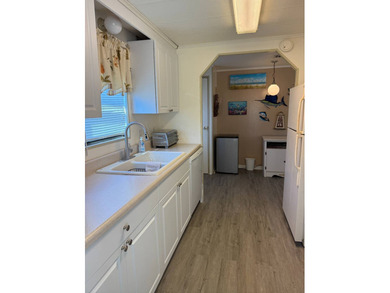 This lovely, manufactured home is on leased land in Lake on Pine Lakes Country Club in Florida - for sale on GolfHomes.com, golf home, golf lot