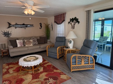 This lovely, manufactured home is on leased land in Lake on Pine Lakes Country Club in Florida - for sale on GolfHomes.com, golf home, golf lot