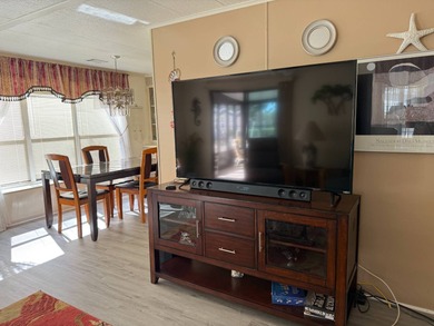 This lovely, manufactured home is on leased land in Lake on Pine Lakes Country Club in Florida - for sale on GolfHomes.com, golf home, golf lot