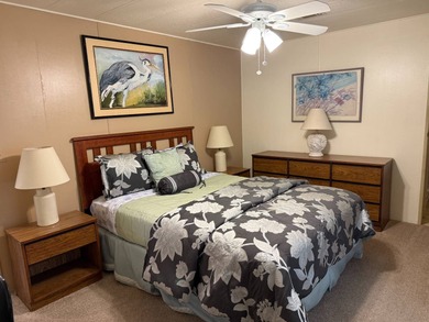 This lovely, manufactured home is on leased land in Lake on Pine Lakes Country Club in Florida - for sale on GolfHomes.com, golf home, golf lot