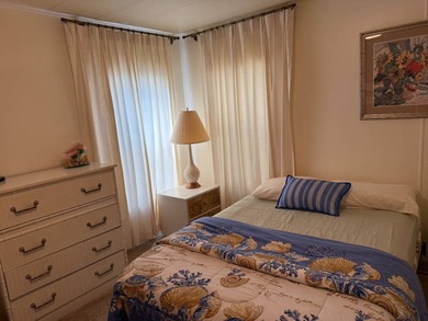 This lovely, manufactured home is on leased land in Lake on Pine Lakes Country Club in Florida - for sale on GolfHomes.com, golf home, golf lot