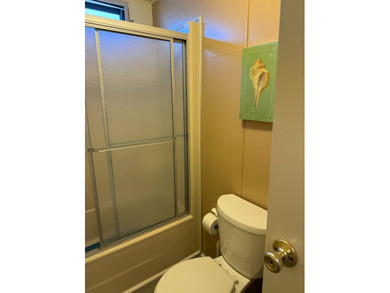 This lovely, manufactured home is on leased land in Lake on Pine Lakes Country Club in Florida - for sale on GolfHomes.com, golf home, golf lot