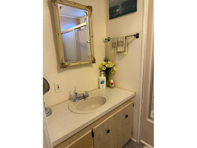 This lovely, manufactured home is on leased land in Lake on Pine Lakes Country Club in Florida - for sale on GolfHomes.com, golf home, golf lot