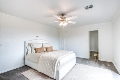 Welcome to a refined residence nestled on the prestigious west on Oak Tree National Golf and Country Club in Oklahoma - for sale on GolfHomes.com, golf home, golf lot