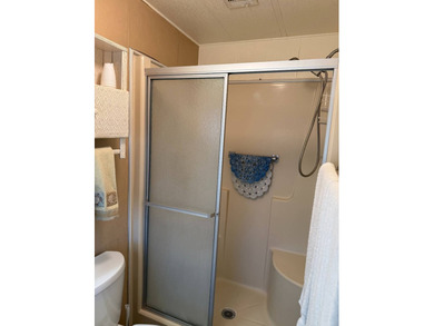 This lovely, manufactured home is on leased land in Lake on Pine Lakes Country Club in Florida - for sale on GolfHomes.com, golf home, golf lot