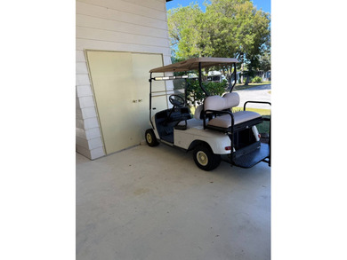 This lovely, manufactured home is on leased land in Lake on Pine Lakes Country Club in Florida - for sale on GolfHomes.com, golf home, golf lot