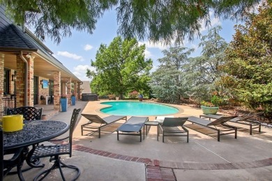 Welcome to a refined residence nestled on the prestigious west on Oak Tree National Golf and Country Club in Oklahoma - for sale on GolfHomes.com, golf home, golf lot
