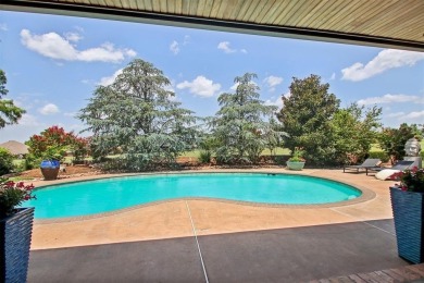 Welcome to a refined residence nestled on the prestigious west on Oak Tree National Golf and Country Club in Oklahoma - for sale on GolfHomes.com, golf home, golf lot