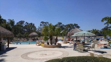 This lovely, manufactured home is on leased land in Lake on Pine Lakes Country Club in Florida - for sale on GolfHomes.com, golf home, golf lot