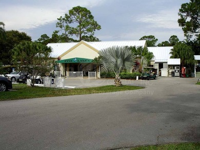 This lovely, manufactured home is on leased land in Lake on Pine Lakes Country Club in Florida - for sale on GolfHomes.com, golf home, golf lot