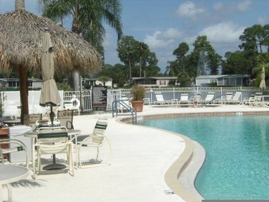 This lovely, manufactured home is on leased land in Lake on Pine Lakes Country Club in Florida - for sale on GolfHomes.com, golf home, golf lot