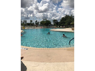 This lovely, manufactured home is on leased land in Lake on Pine Lakes Country Club in Florida - for sale on GolfHomes.com, golf home, golf lot