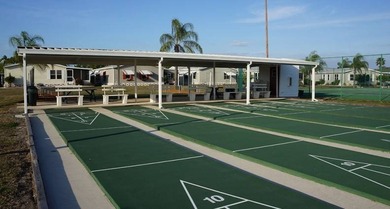 This lovely, manufactured home is on leased land in Lake on Pine Lakes Country Club in Florida - for sale on GolfHomes.com, golf home, golf lot