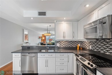 Experience effortless, resort-style living in this fully updated on Wynmoor Golf Course in Florida - for sale on GolfHomes.com, golf home, golf lot